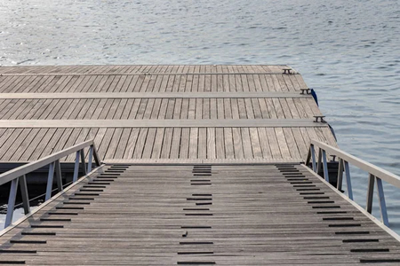 Technician soft washing a lake gaston boathouse roof in henrico nc